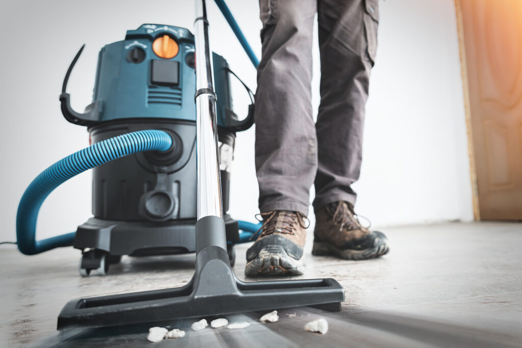 Close up on construction vacuum cleaner, construction cleaning service